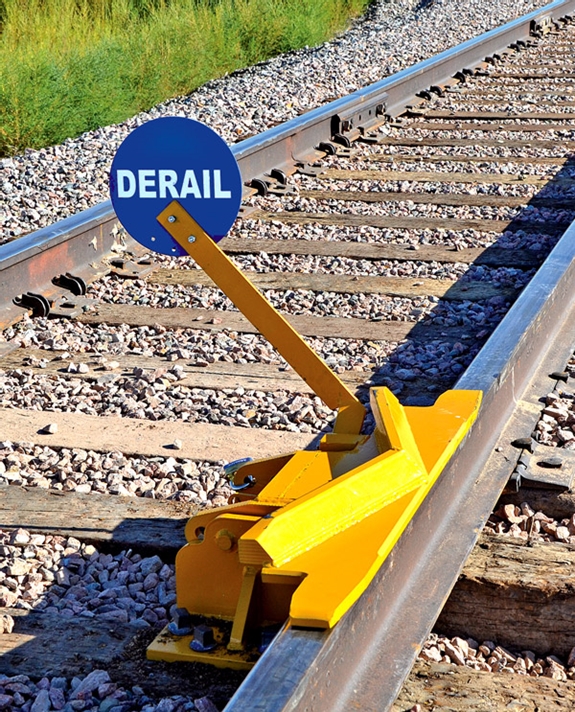 2-Way Hinged Derail (for Locomotive) with manual sign holder
suitable for 6-axle and 4-axle locomotives and all freight cars.
Low-angle deflection bar accommodates longer wheel base of 6-axle locomotives. Allow ample space alongside the track for derail